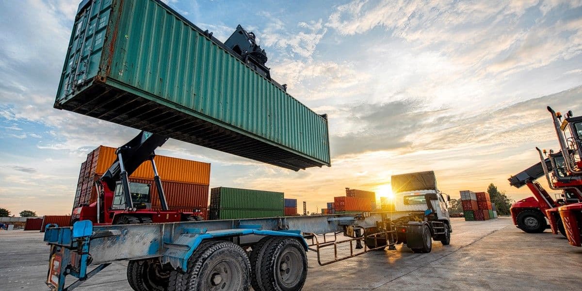 40 foot container being placed on a truck